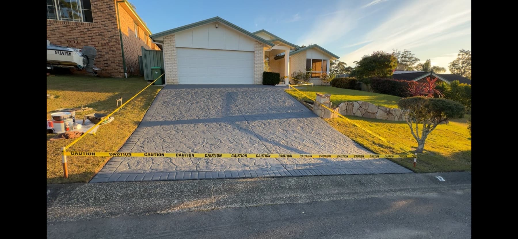 A freshly colour-sealed charcoal stencil driveway on the Central Coast